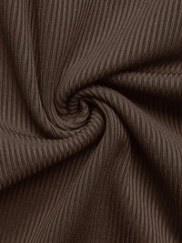 Close-up of brown ribbed fabric with a swirling pattern