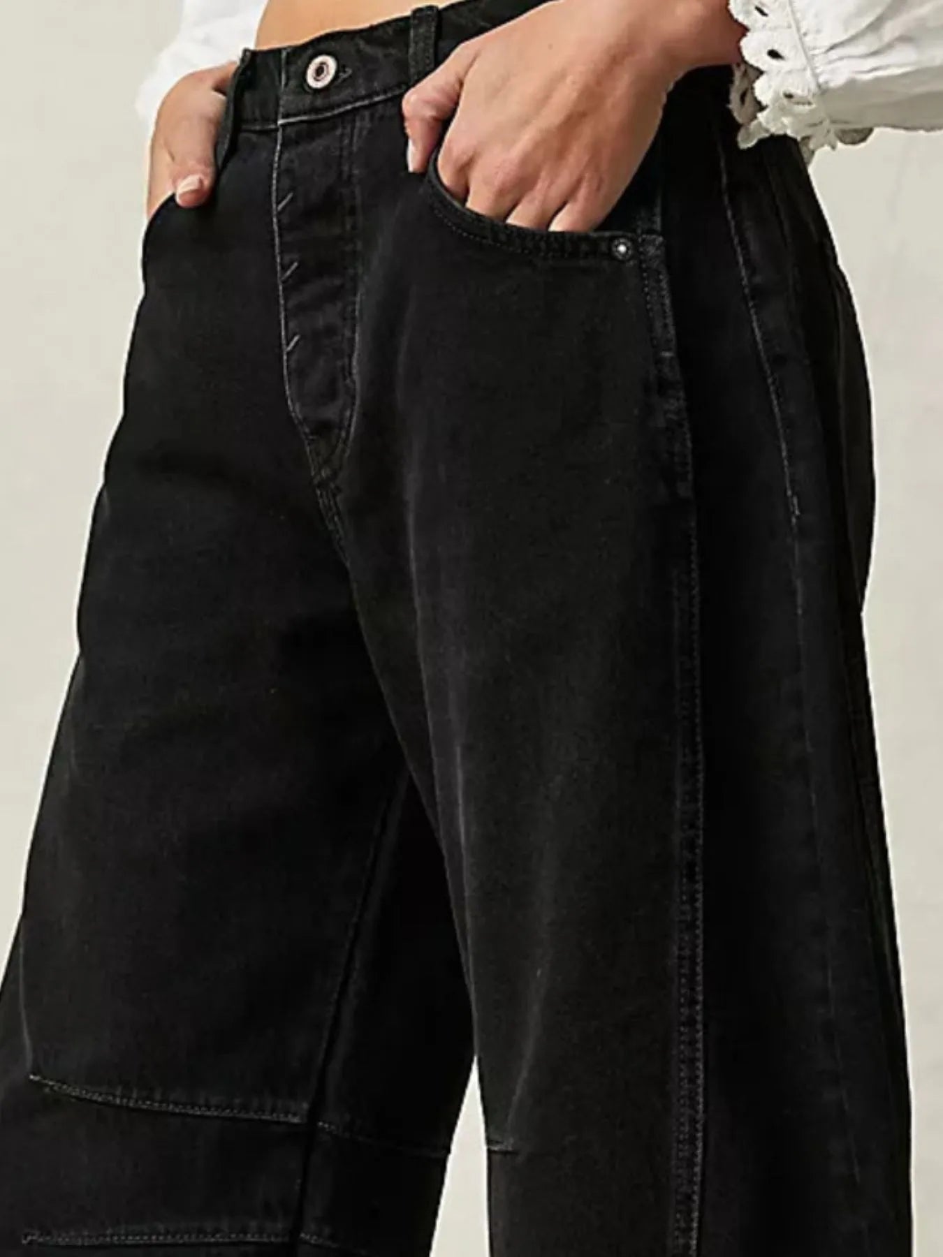 Black jeans worn by a person with a neutral background