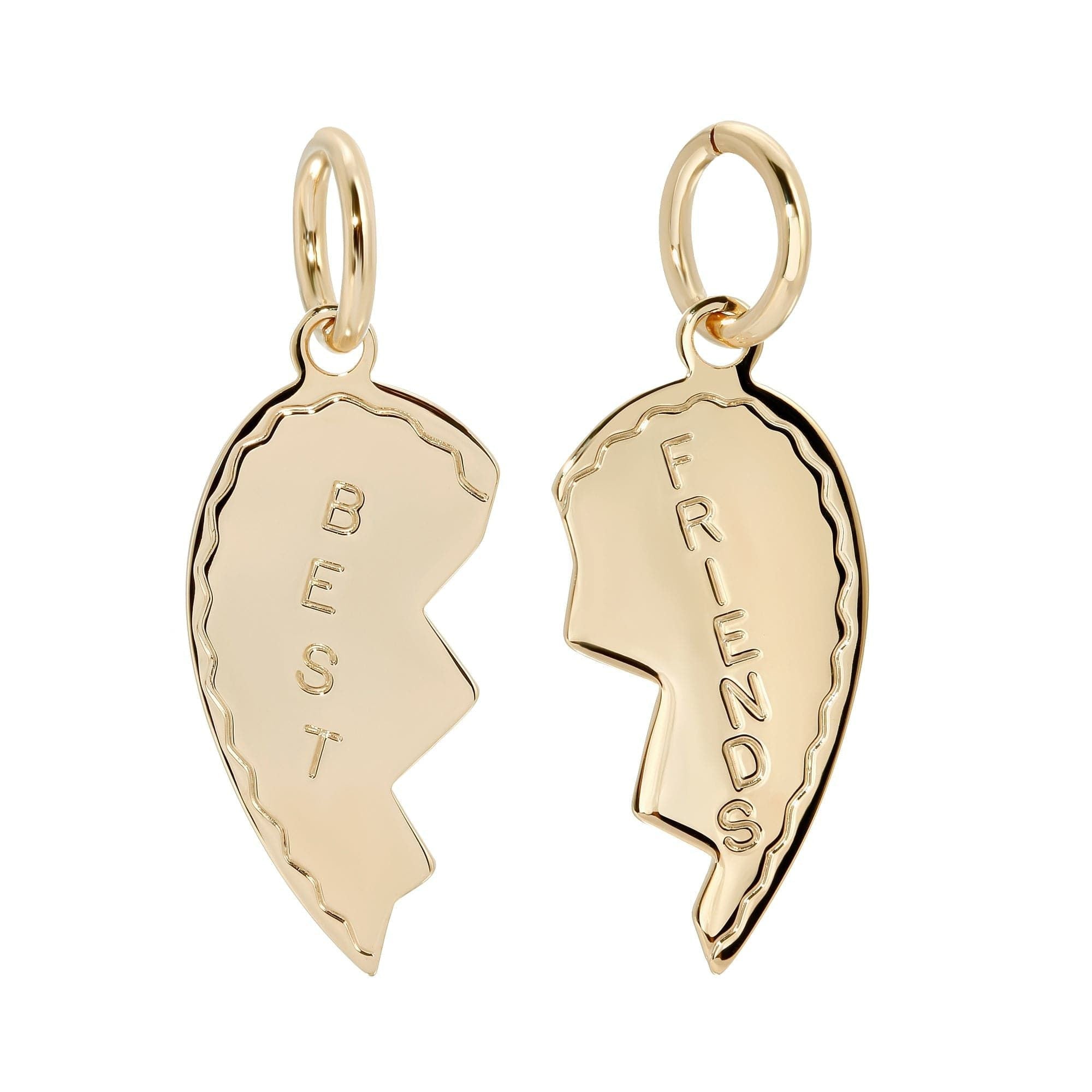Two gold-colored best friend charms in the shape of heart-like pieces, with one piece labeled 'BFF'.