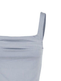 Light gray dress with thin straps on a white background