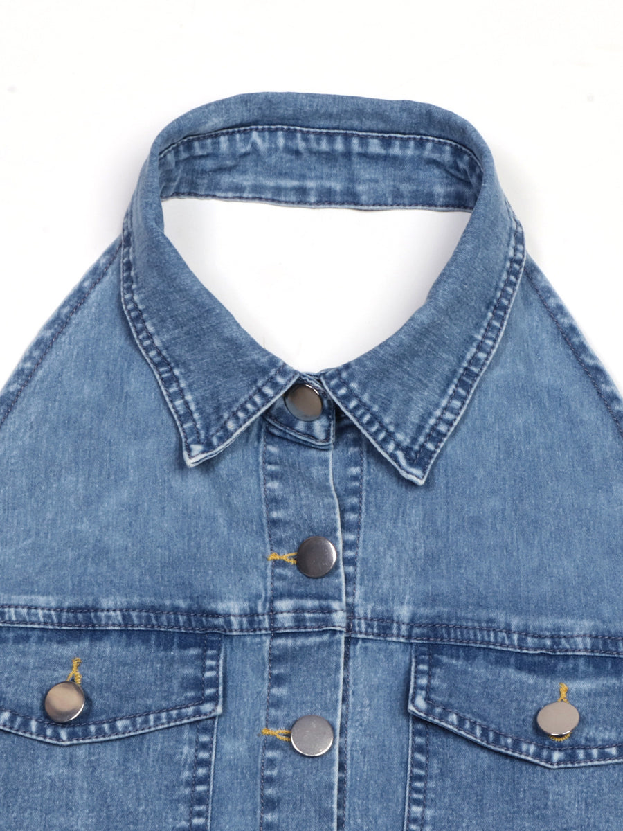 Close-up of a blue denim jacket with collar and buttons on a white background