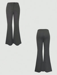 Pair of gray flared pants on a light gray background