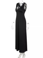 Black evening gown with lace detailing on a white background