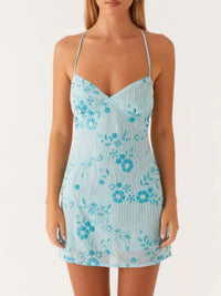 Light blue floral dress worn by a model on a white background