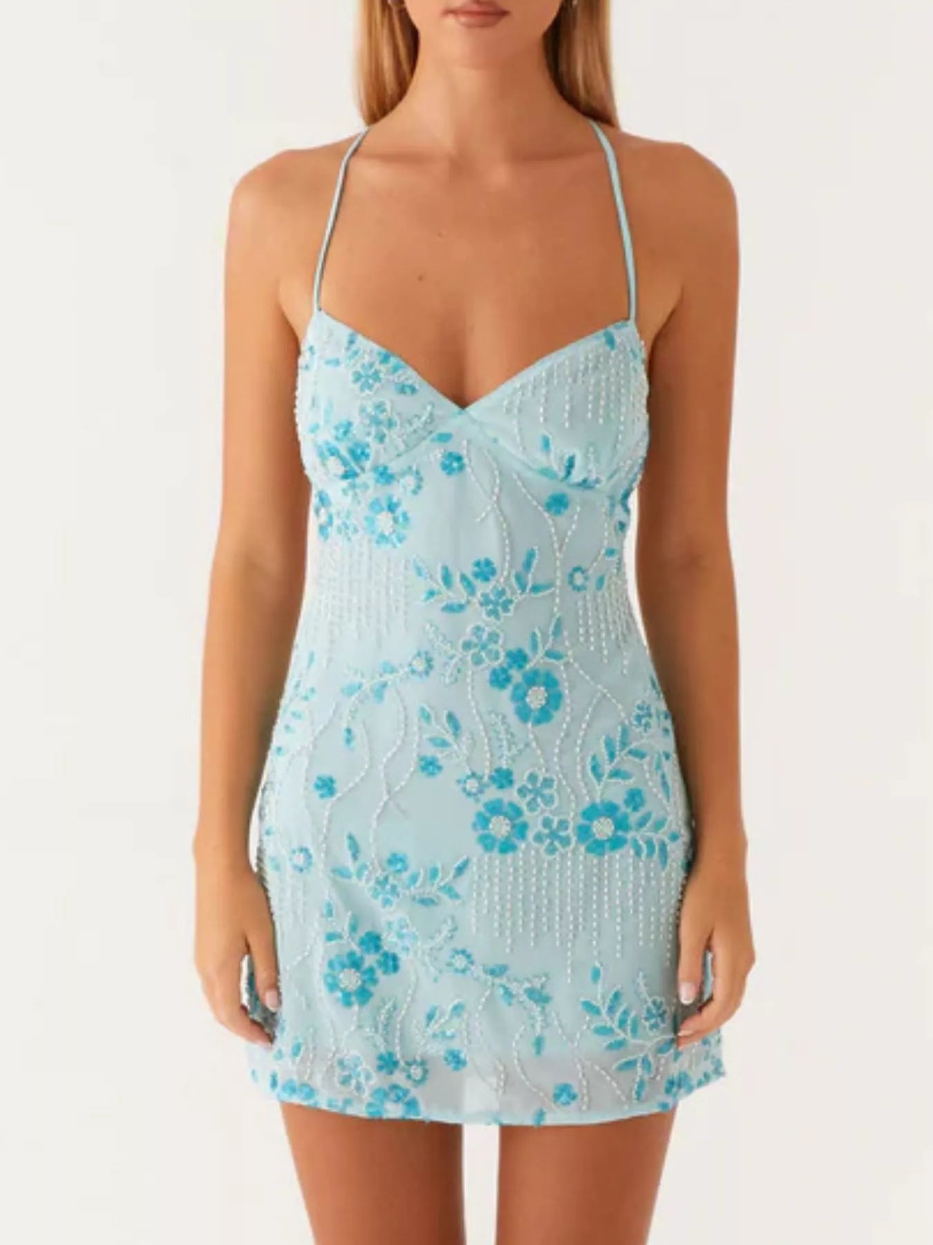 Light blue floral dress worn by a model on a white background
