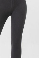 Black leggings on a white background