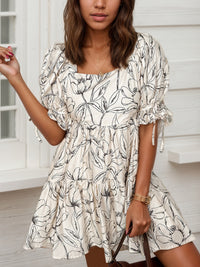 Woman wearing a floral dress with a white background