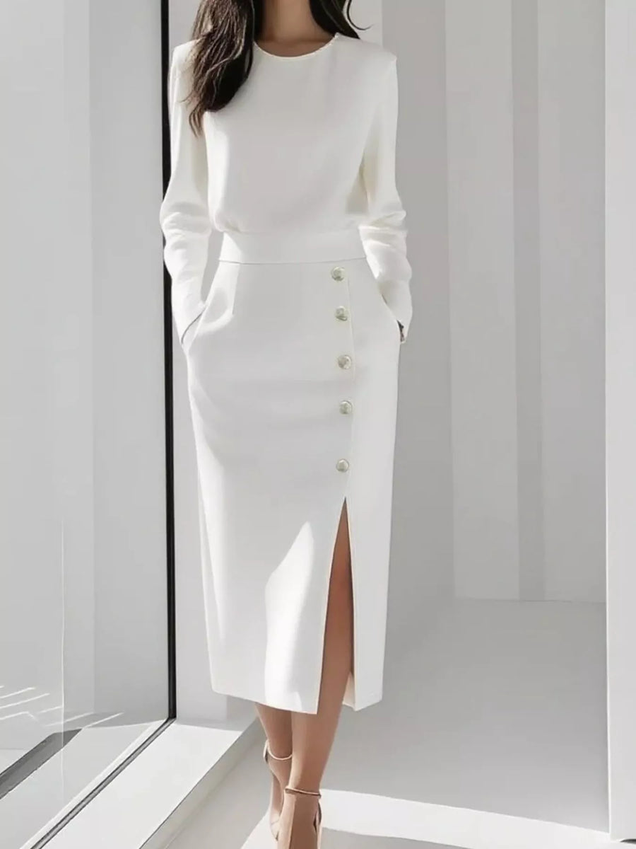 White long-sleeve top and skirt set against a neutral background