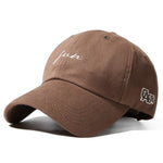 Brown cap with white text and logo on a white background