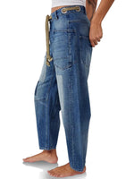 Blue denim pants with a unique design on a white background