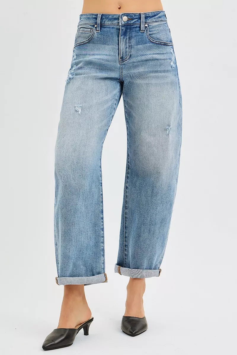 Light blue jeans worn by a person on a white background