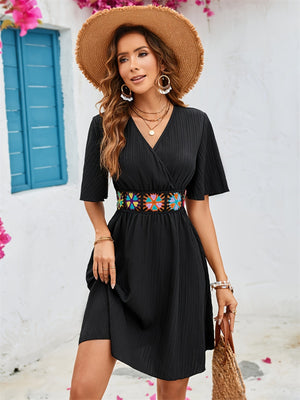 Full view of black Surplice Flutter Sleeve Mini Dress