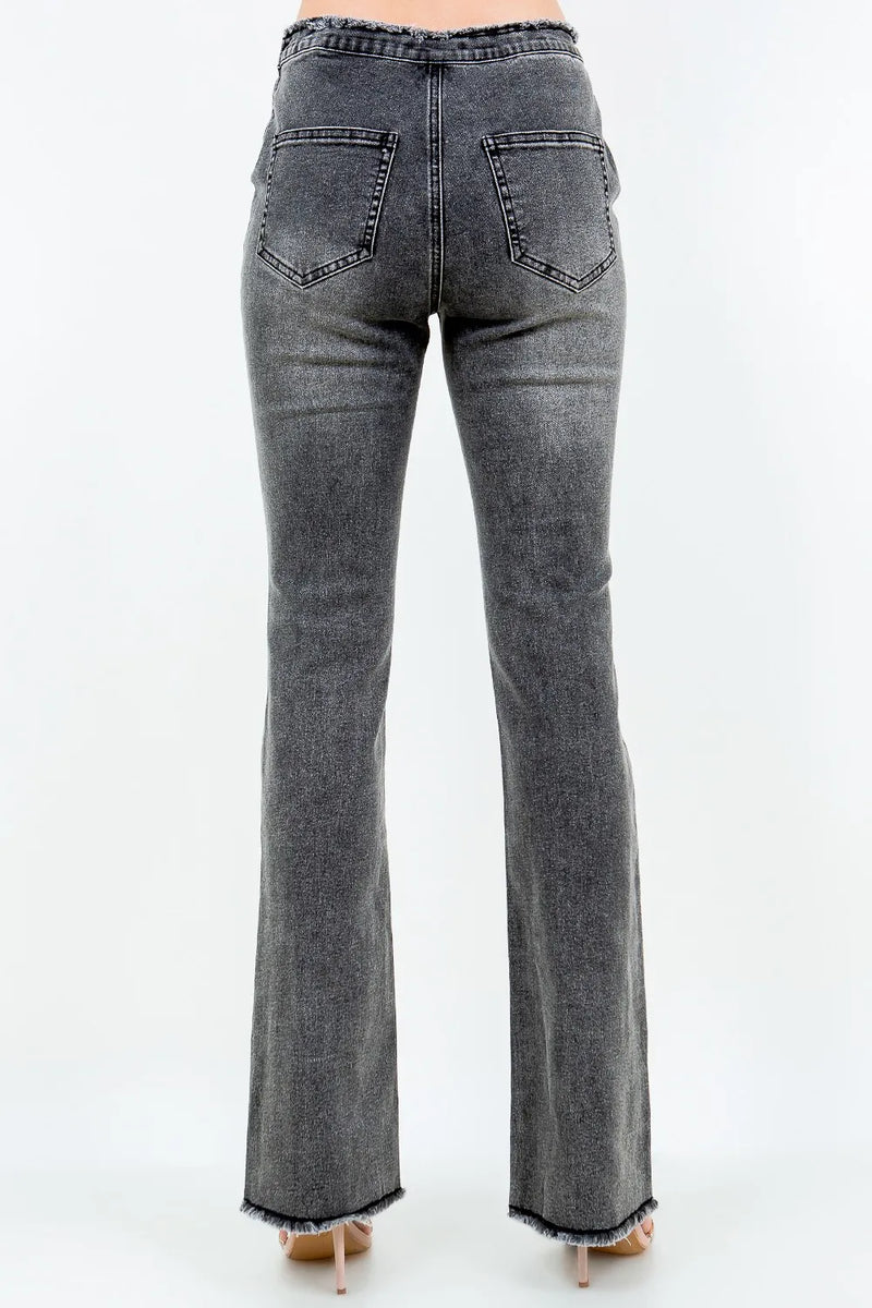 Gray flared jeans on a white background