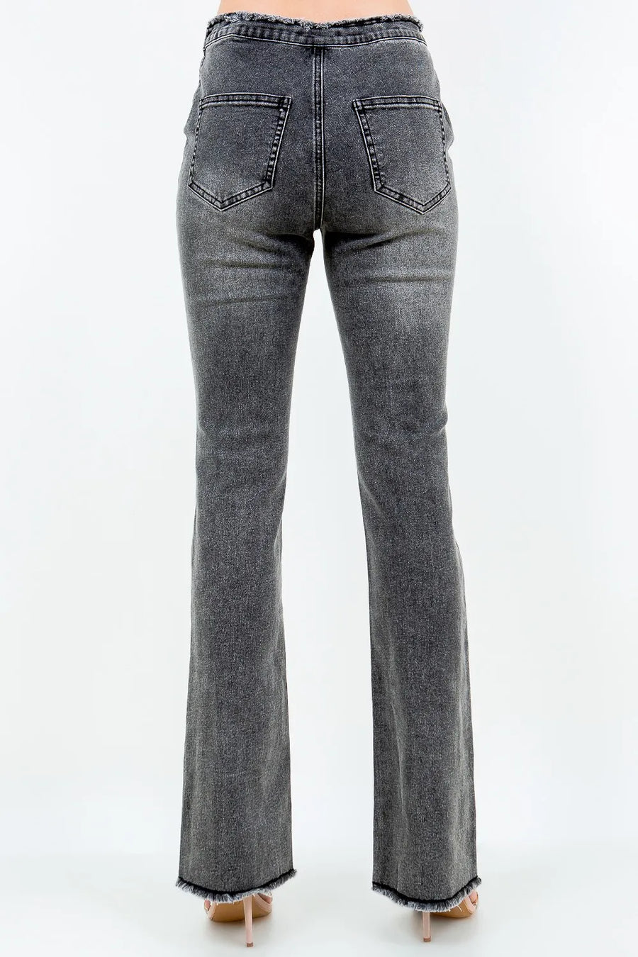 Gray flared jeans on a white background