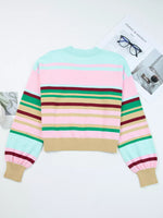 Colorful striped sweater on a white background