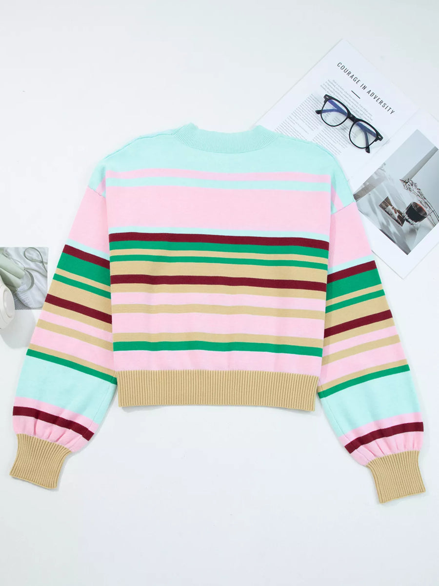 Colorful striped sweater on a white background