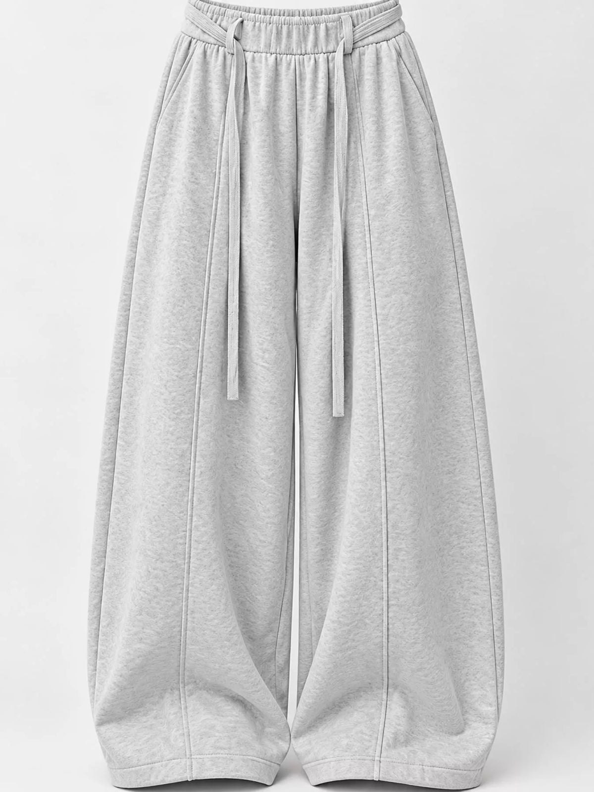 Light gray wide-leg sweatpants with an elastic waistband and drawstring, shown against a plain light gray background.
