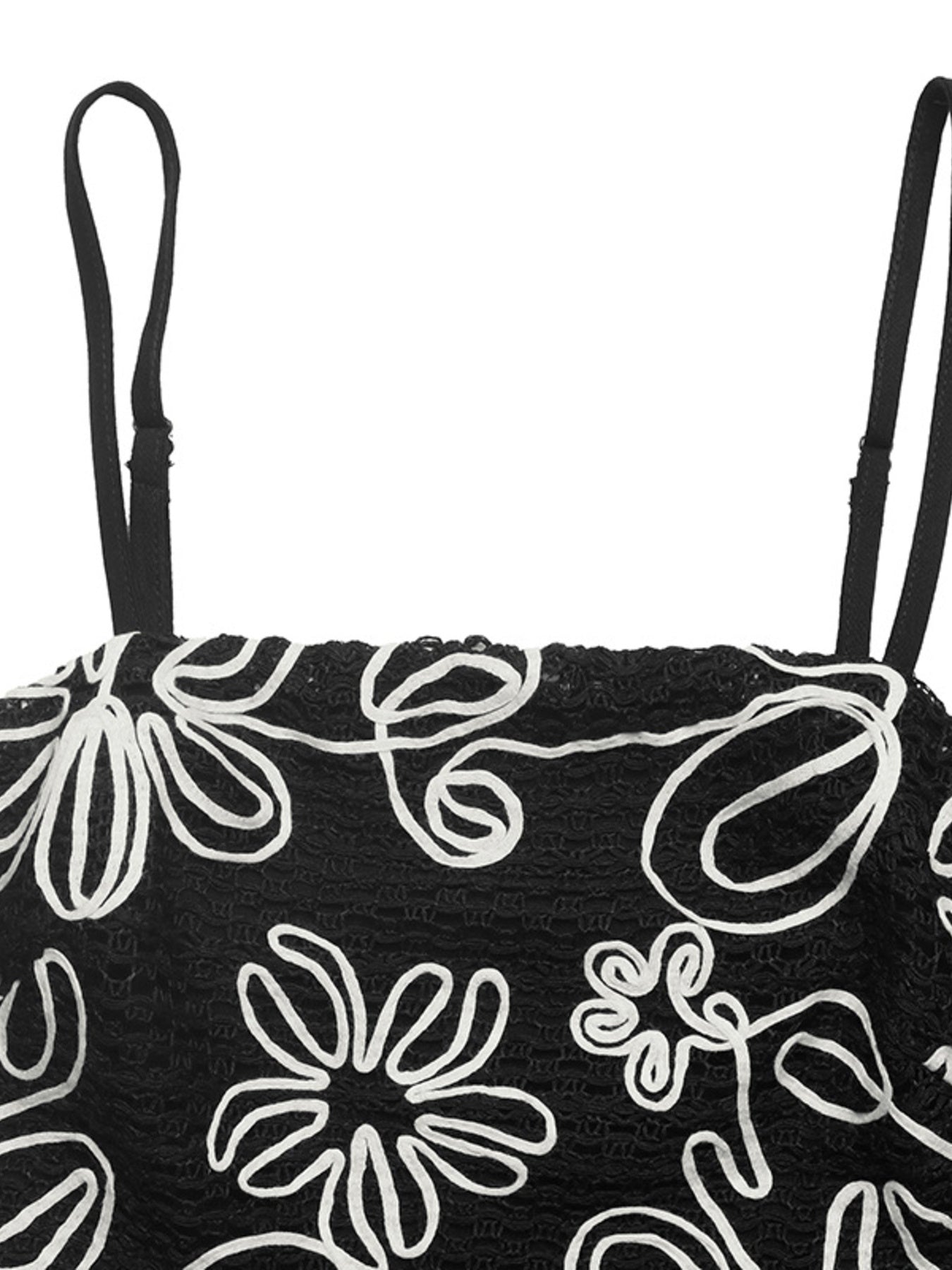 Black bag with white floral patterns on a white background