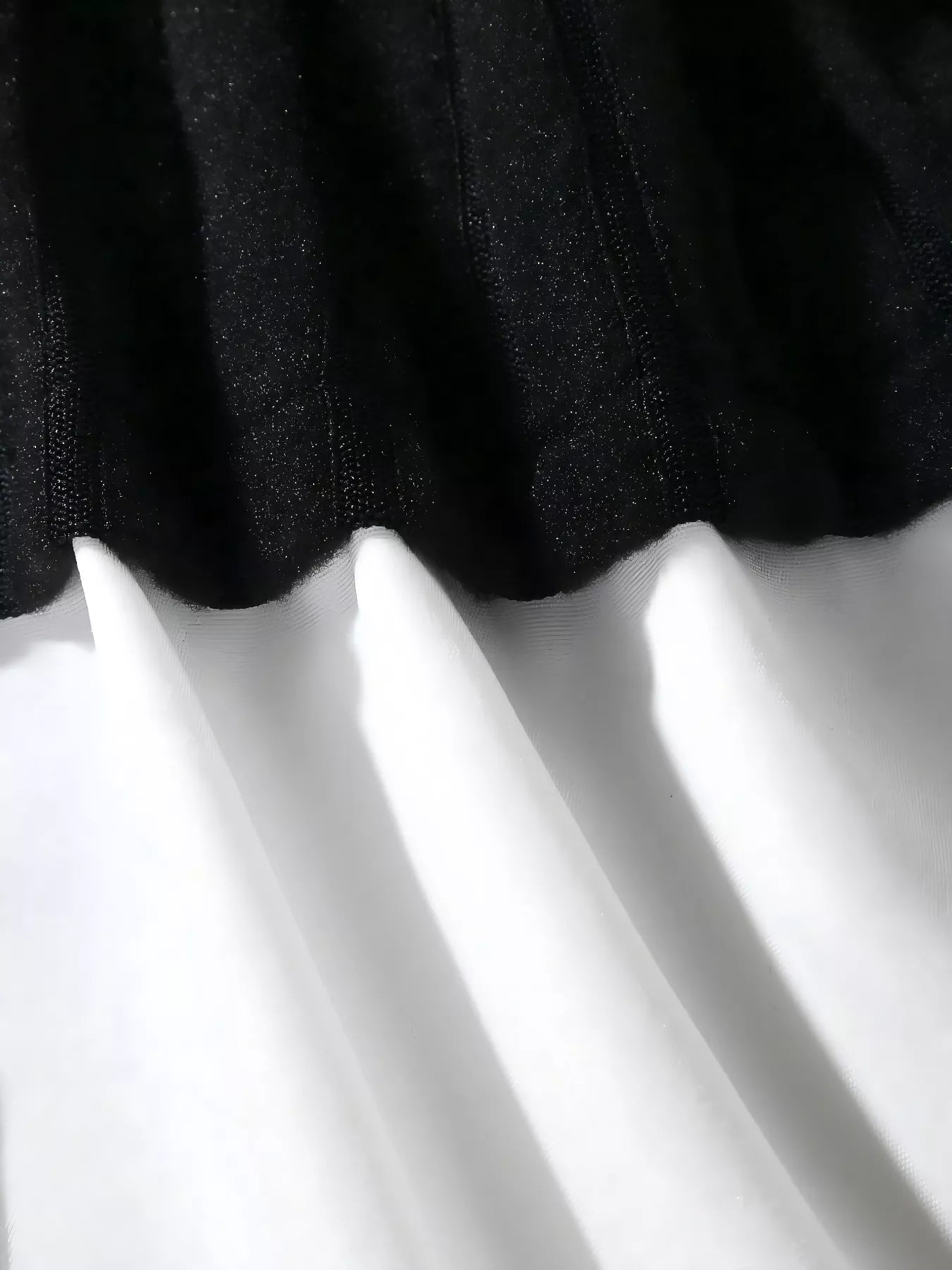 Close-up of black fabric on a white background