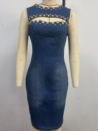 Blue denim dress with decorative cutout details on a mannequin against a plain background