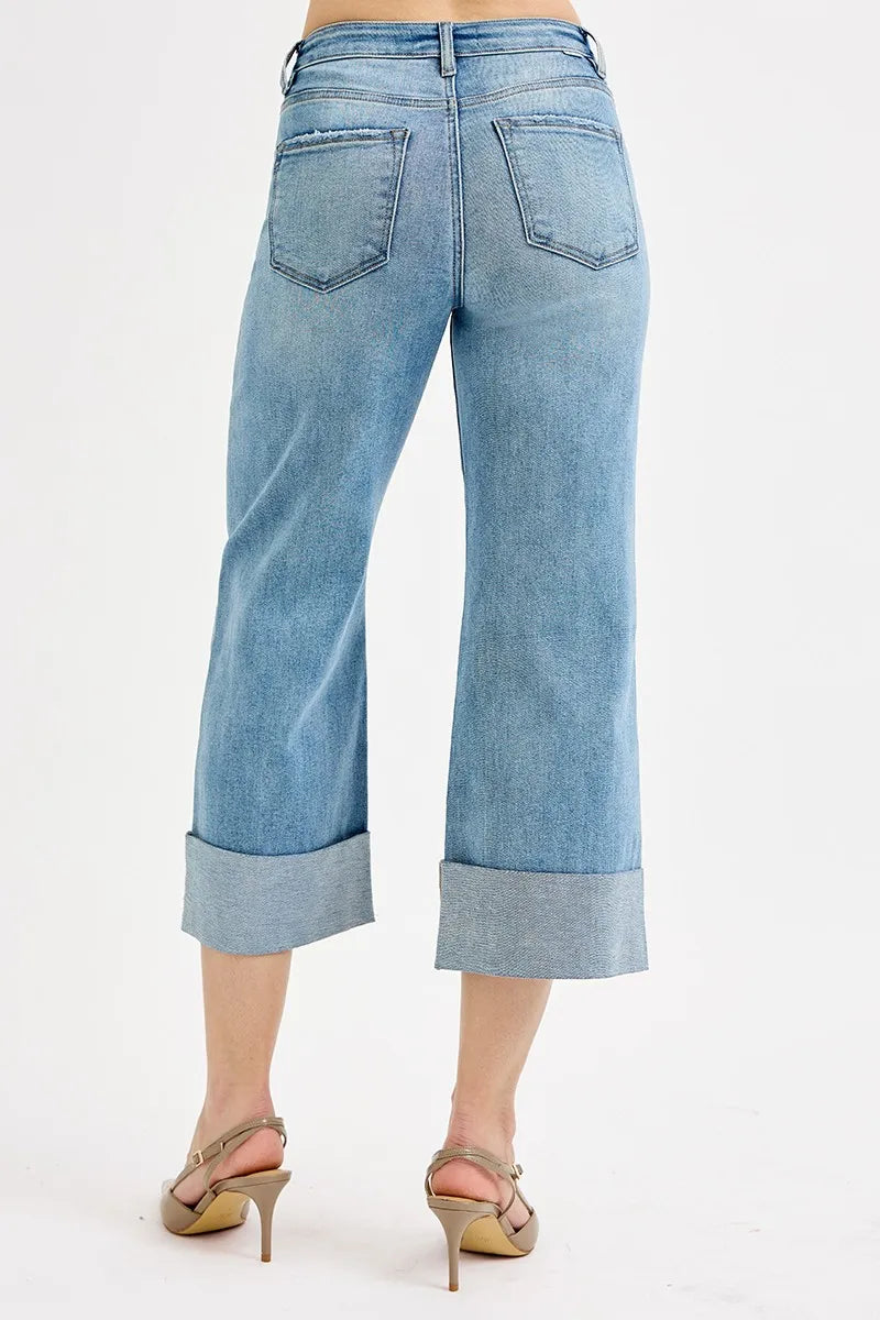 Light blue jeans worn by a person on a white background