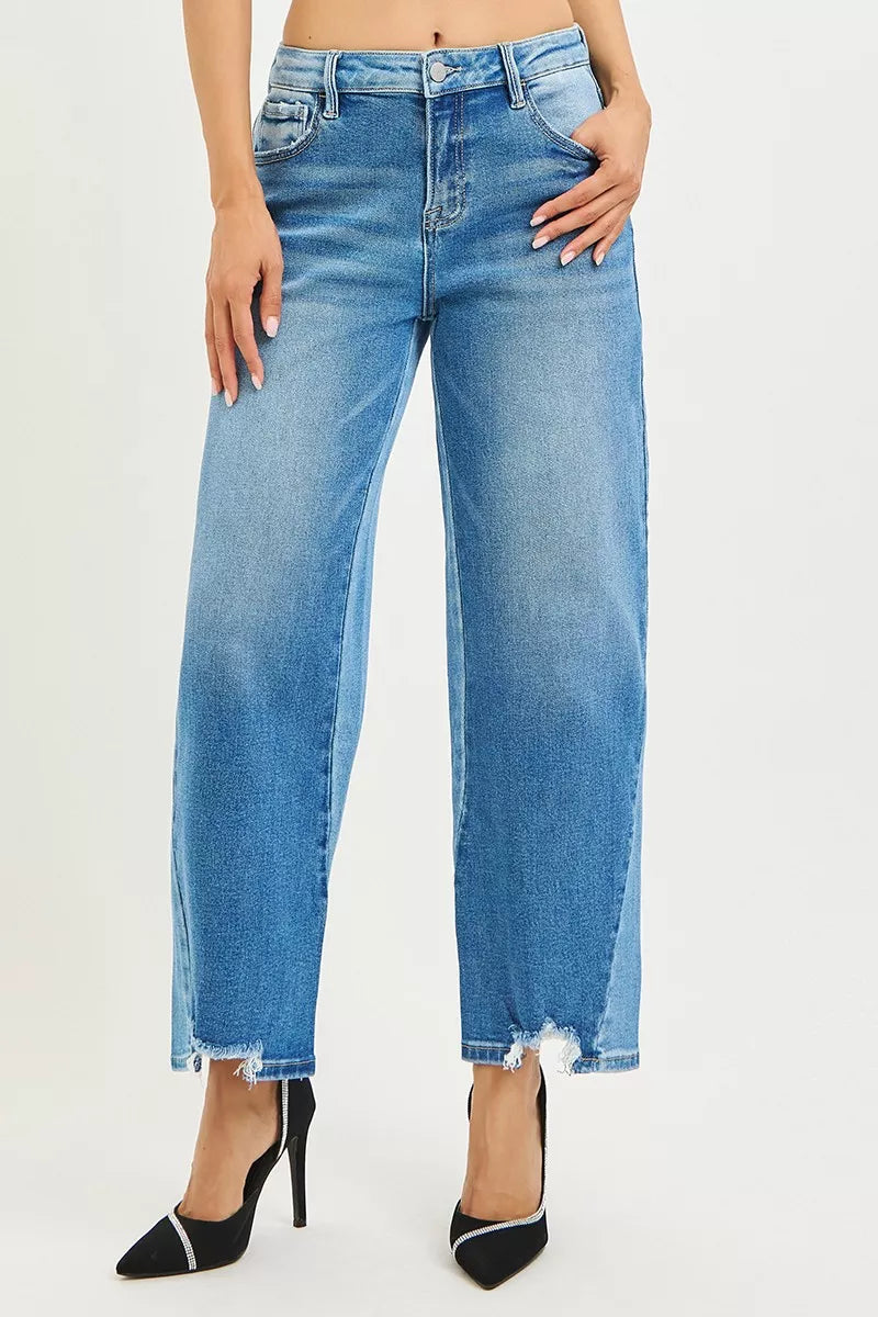 Blue jeans worn by a person on a white background