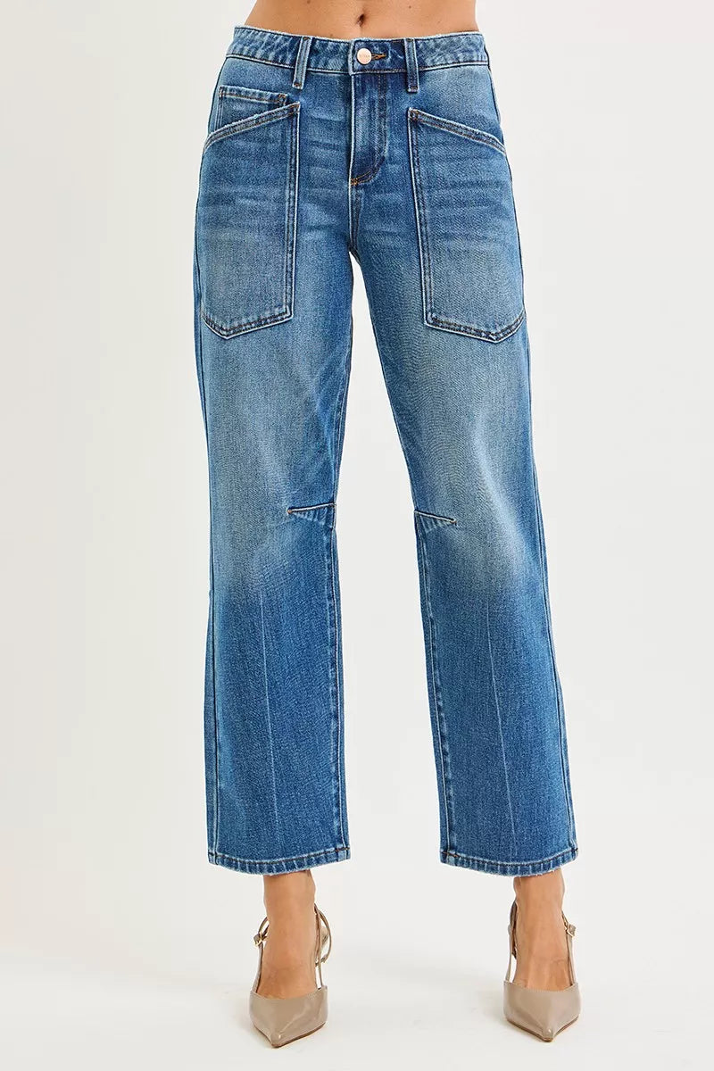 Blue jeans worn by a person on a white background