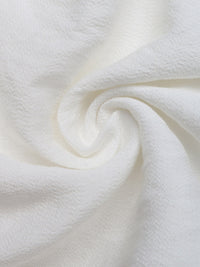Close-up of white fabric with a soft texture