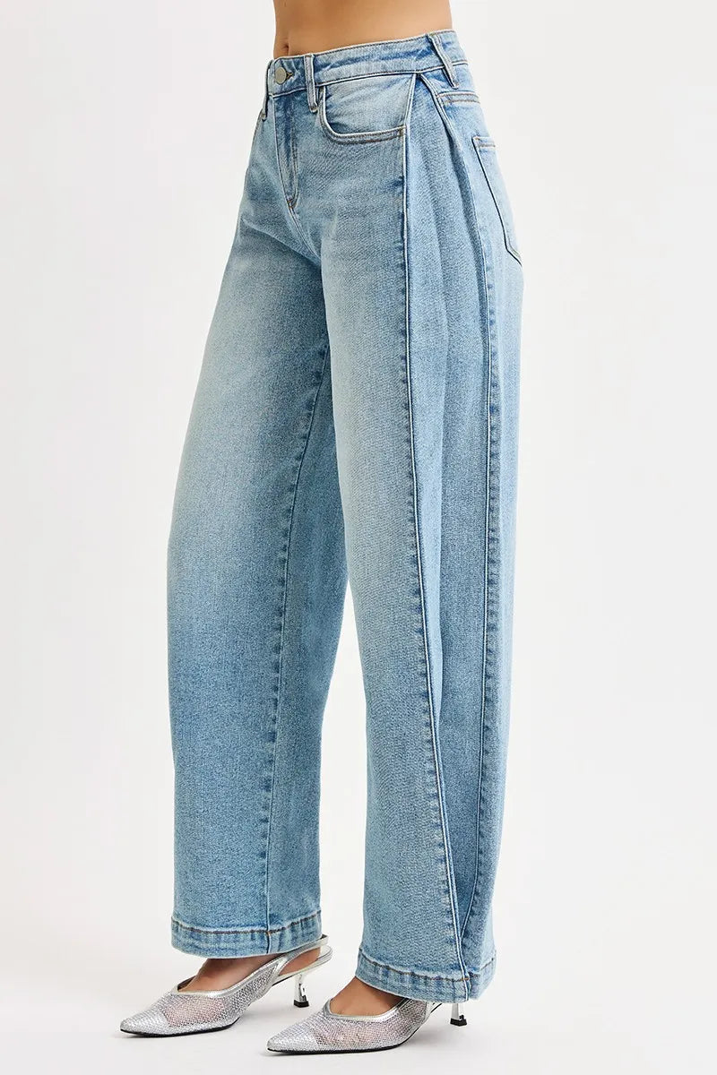 Light blue jeans worn by a person on a white background