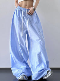 Blue striped wide-leg pants worn by a person on a plain background