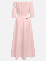 Pink dress with a belt on a white background