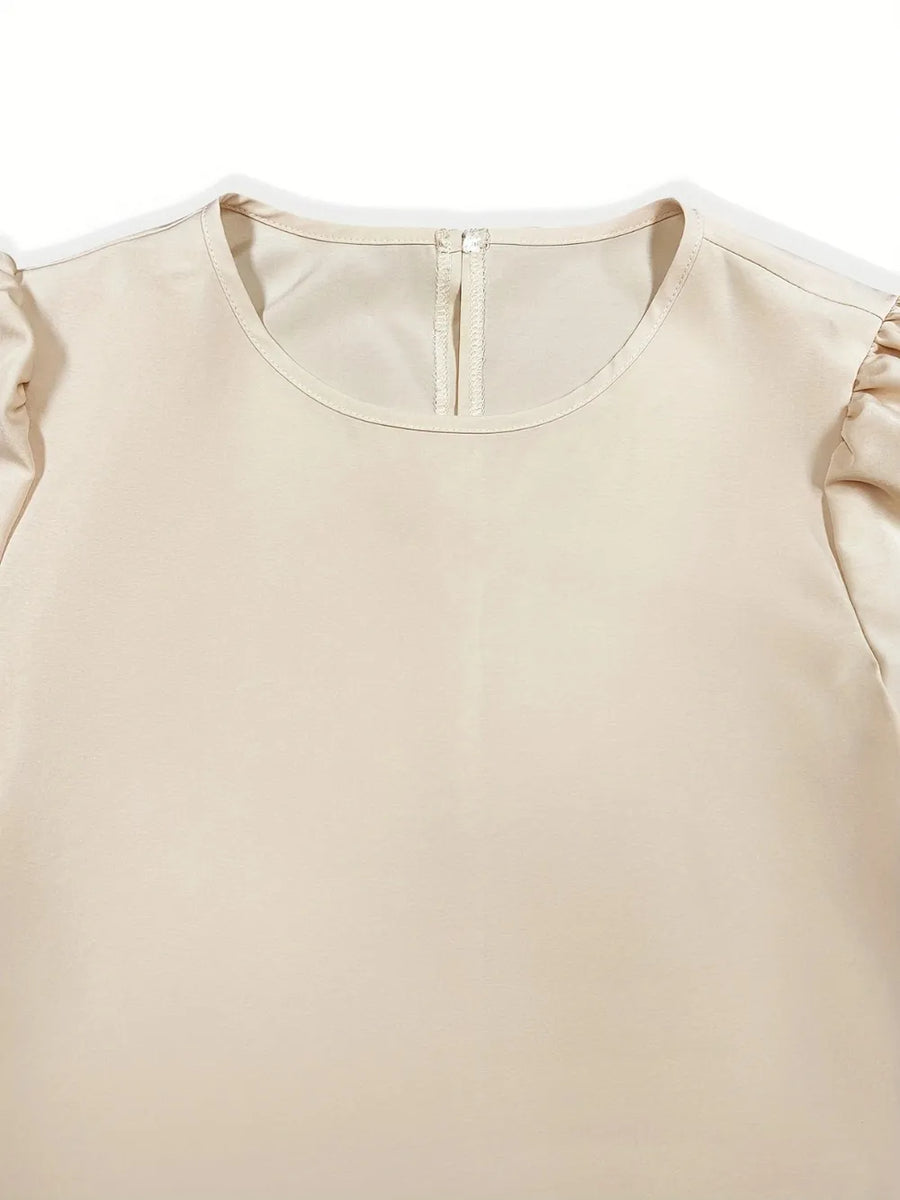 Beige blouse with ruffled sleeves on a white background