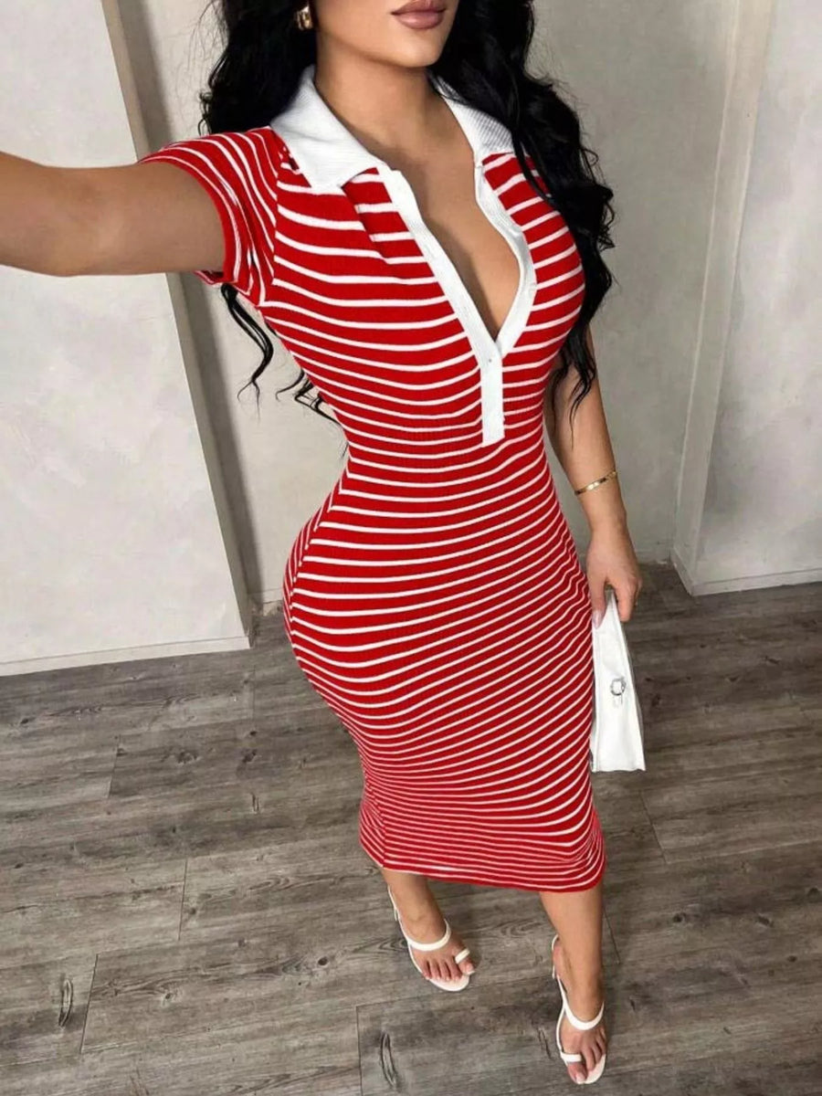 Woman wearing a red and white striped dress with a white collar.