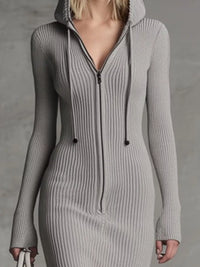 Gray ribbed knit dress with a hood on a plain background