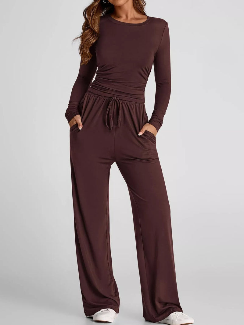 Brown long-sleeve top and wide-leg pants set on a plain background