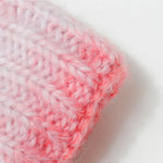 Close-up of a pink and white textured fabric on a light background