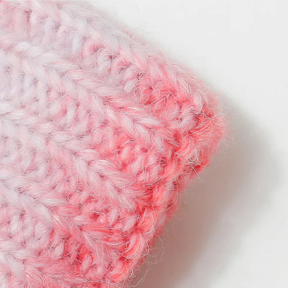 Close-up of a pink and white textured fabric on a light background