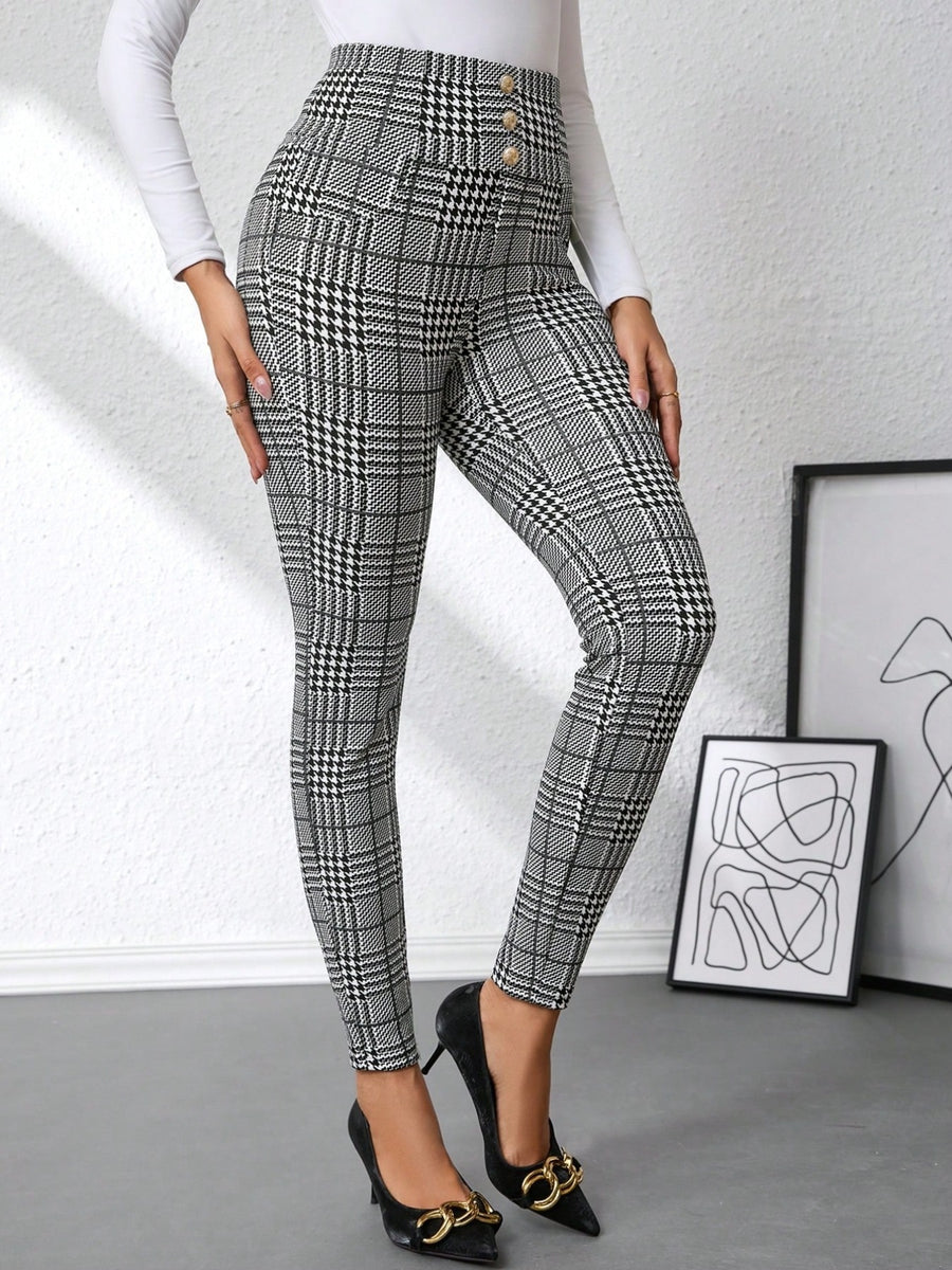 Person wearing plaid pants with a white background