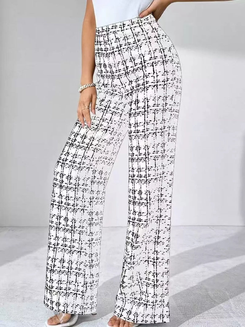 Black and white checkered pants worn by a person on a light gray background