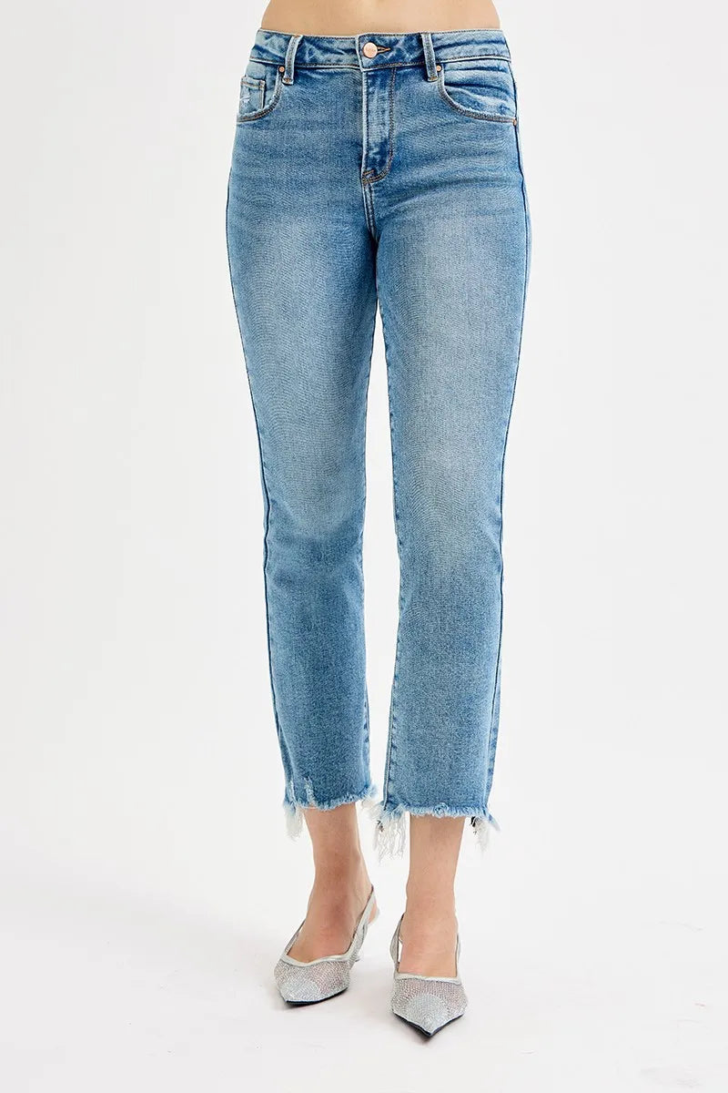 Light blue jeans worn by a person on a white background