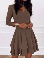 Brown dress worn by a person on a white background