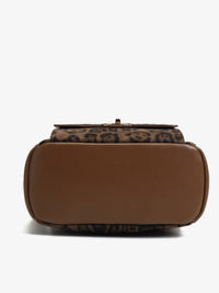 Brown leather bag with leopard print pattern on a white background