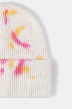 White beanie with pink and yellow tie-dye pattern on a white background