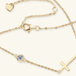 Gold bracelets with various charms on a white background