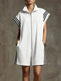 White sleeveless dress with black stripes on a gray background