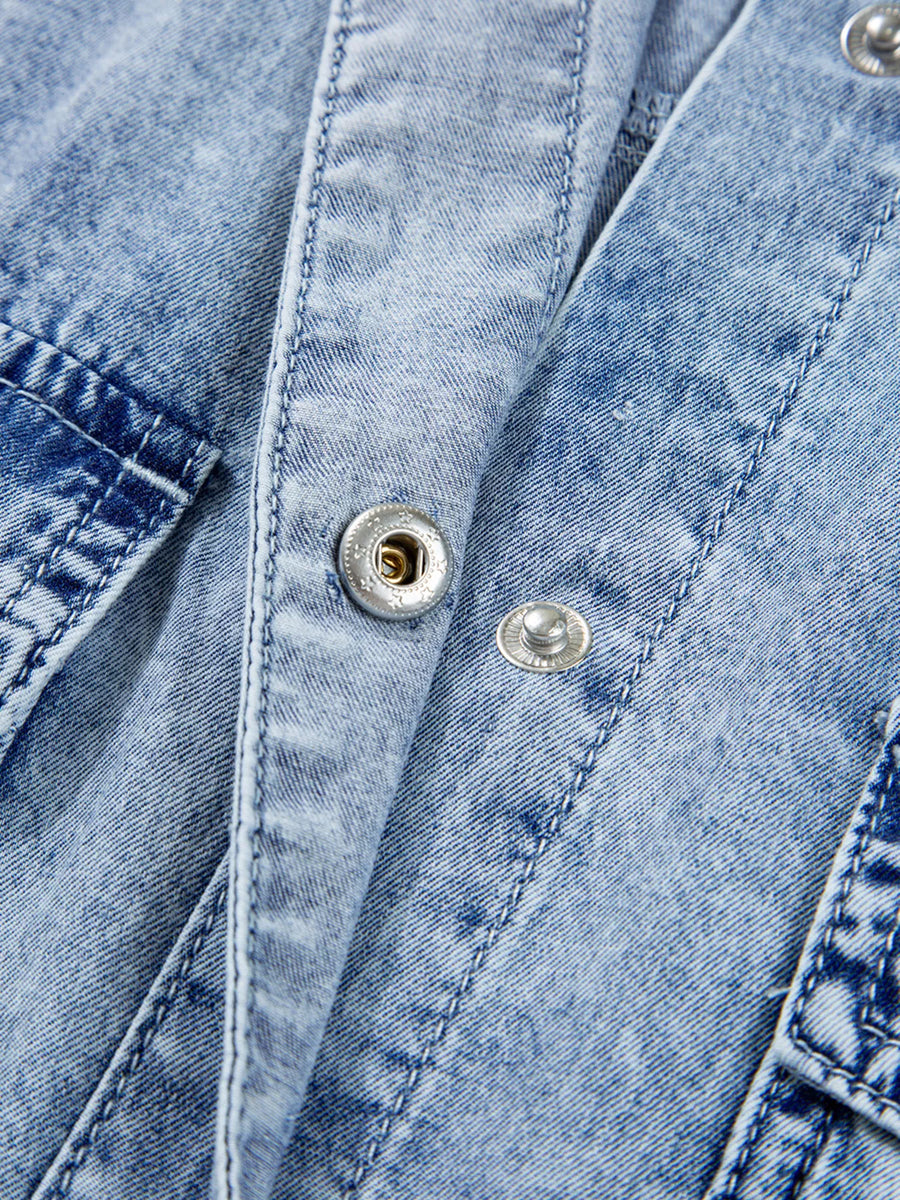 Close-up of a blue denim jacket with buttons
