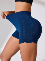 Blue athletic shorts worn by a person on a plain background