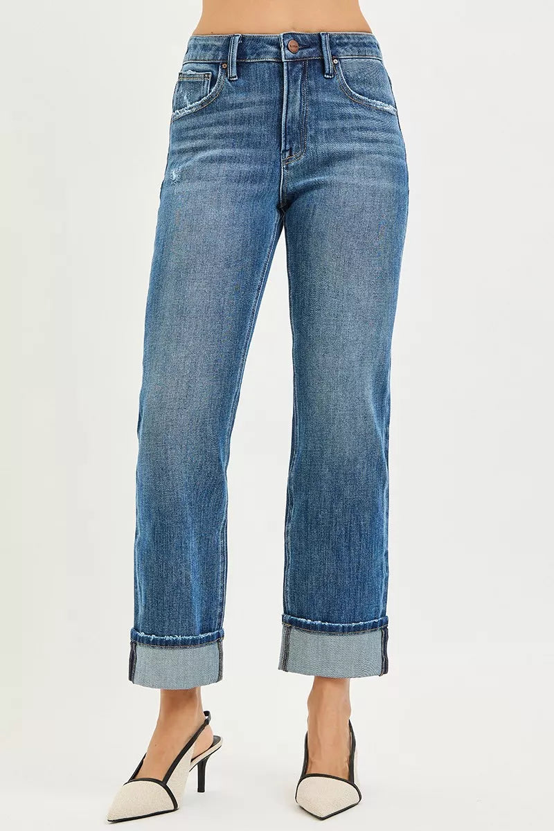 Blue jeans worn by a person on a white background