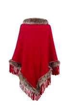Red poncho with fur trim on a white background