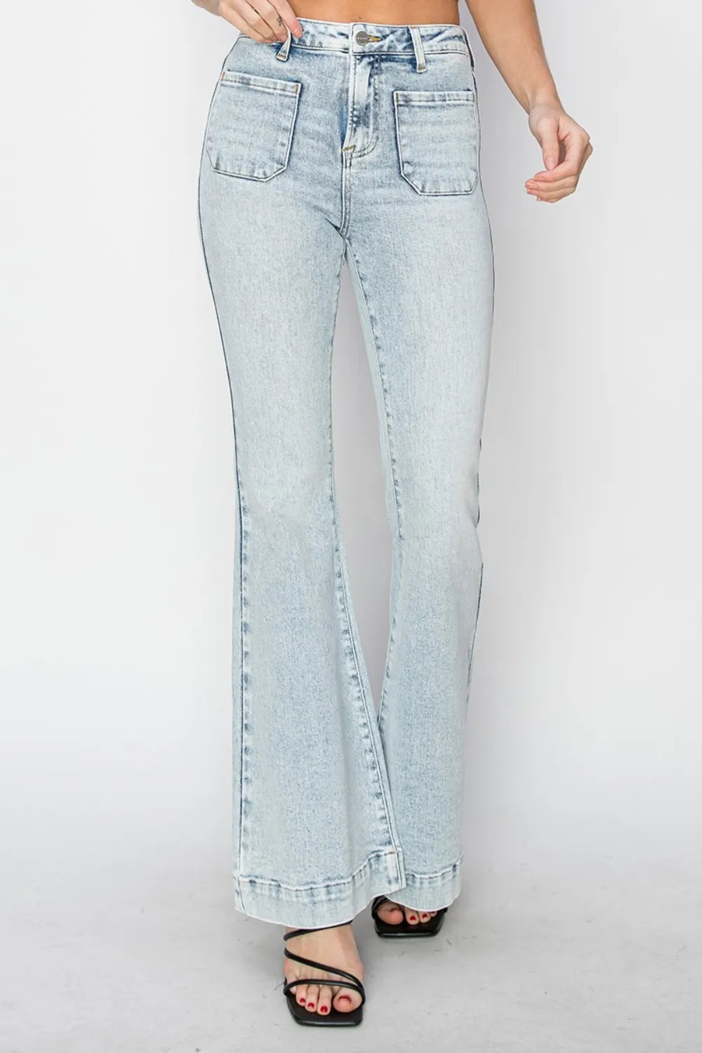 Light blue jeans with a high slit on a white background